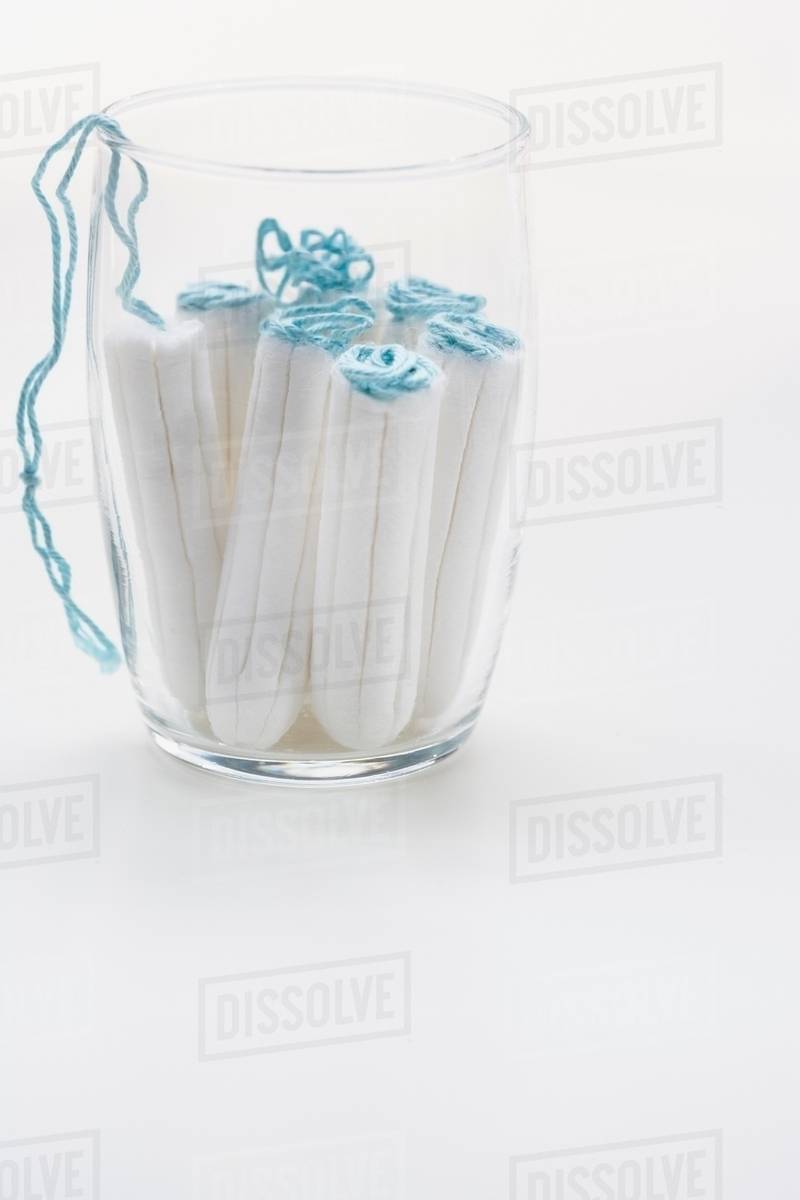 Close up of tampons in glass Stock Photo Dissolve
