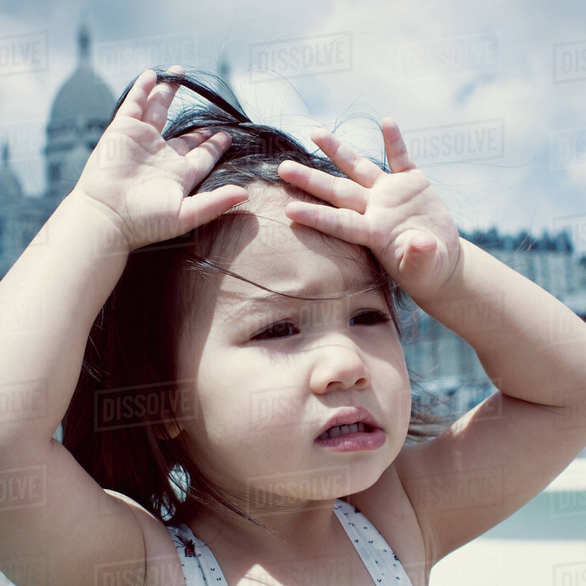 Little girl feeling hot under sun Stock Photo Dissolve