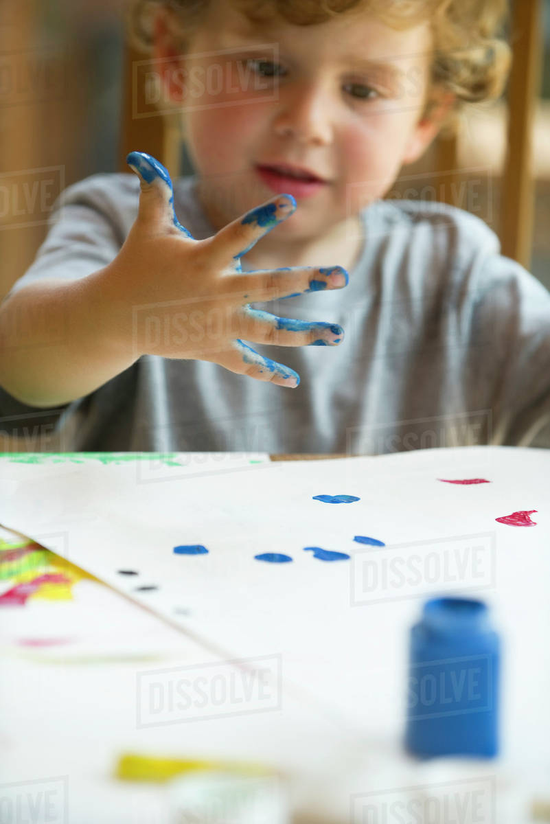 Little boy finger painting Stock Photo Dissolve