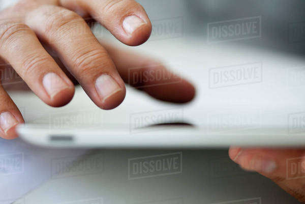 Man using touch screen on digital tablet, cropped - Royalty-free Stock ...