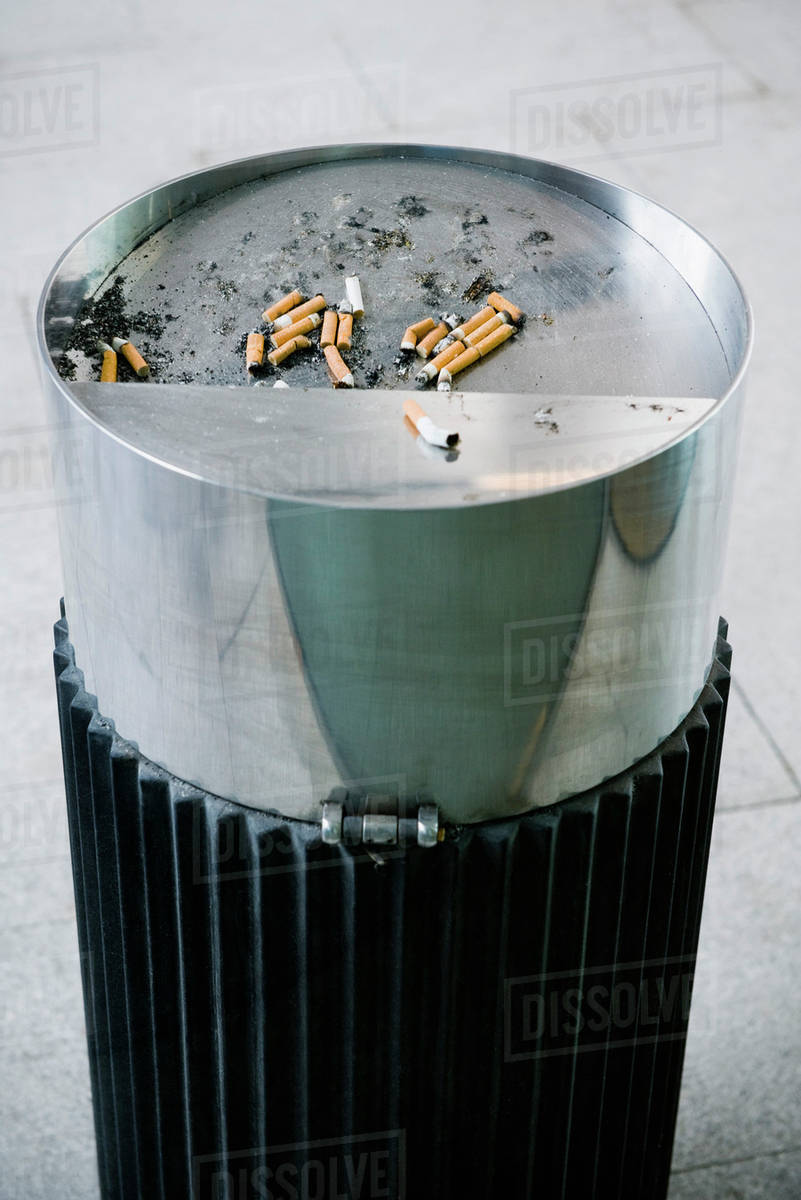 Garbage can with cigarette butts - Royalty-free Stock Photo