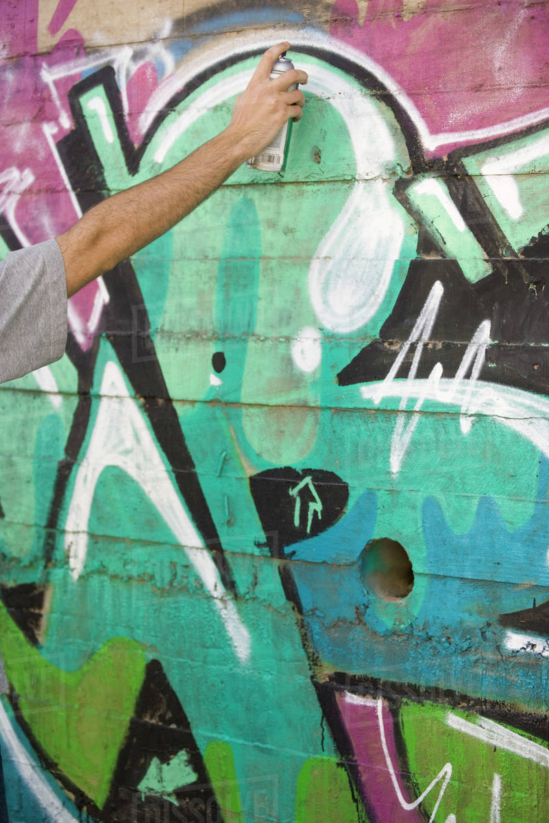 Spray painting graffiti mural Stock Photo Dissolve