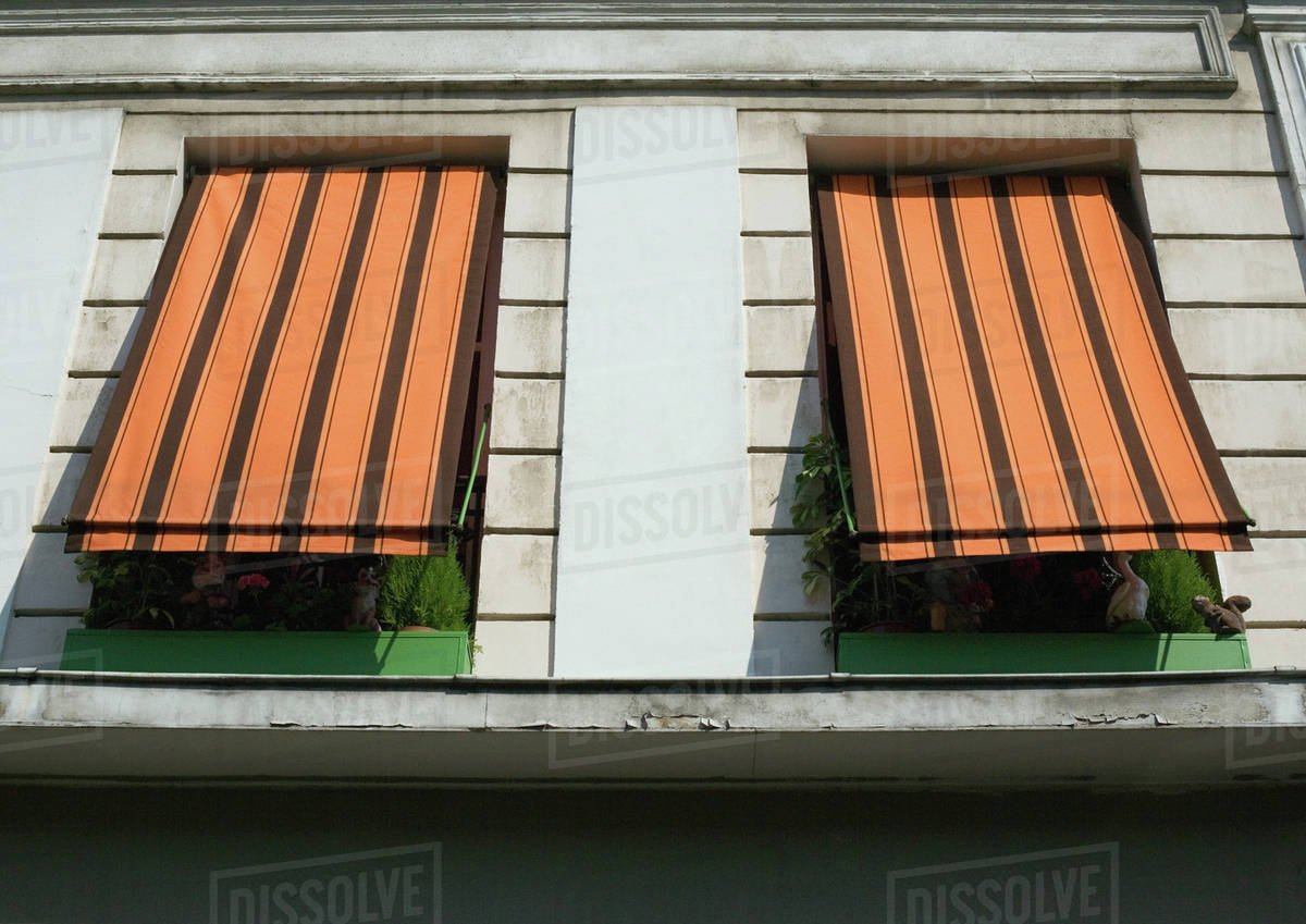 Two Striped Awnings Pulled Down Over Windows Low Angle View Stock Two Striped Awnings Pulled Down Over Windows Low Angle View