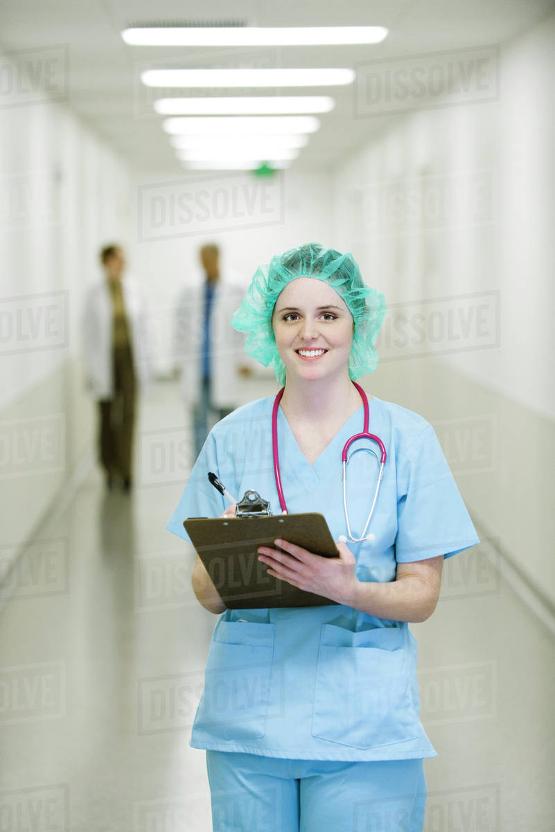 Nurse wearing surgical cap, portrait Stock Photo Dissolve