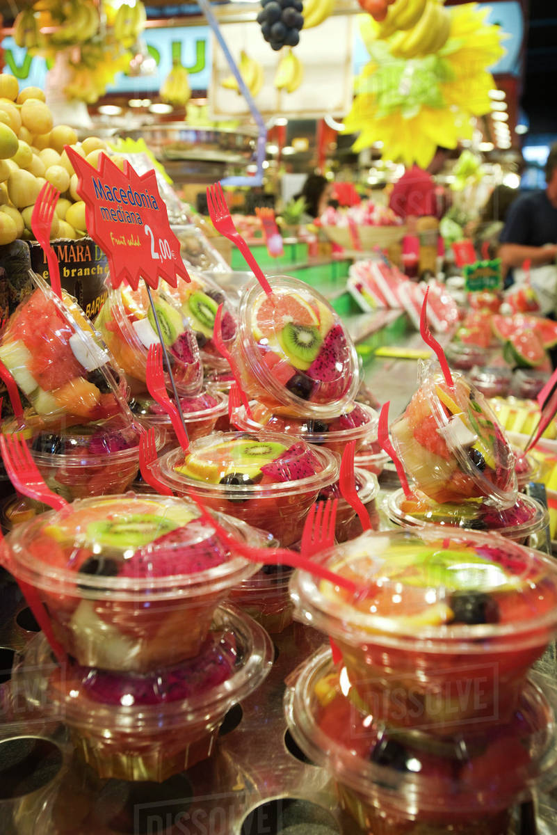Stacked containers of sliced mixed fresh fruit Stock Photo Dissolve