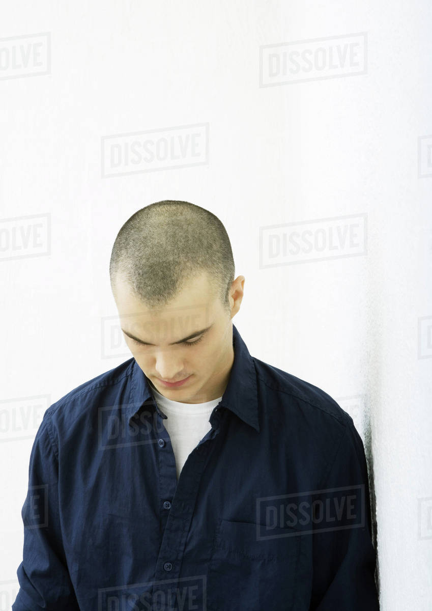 Young man with head down Stock Photo Dissolve