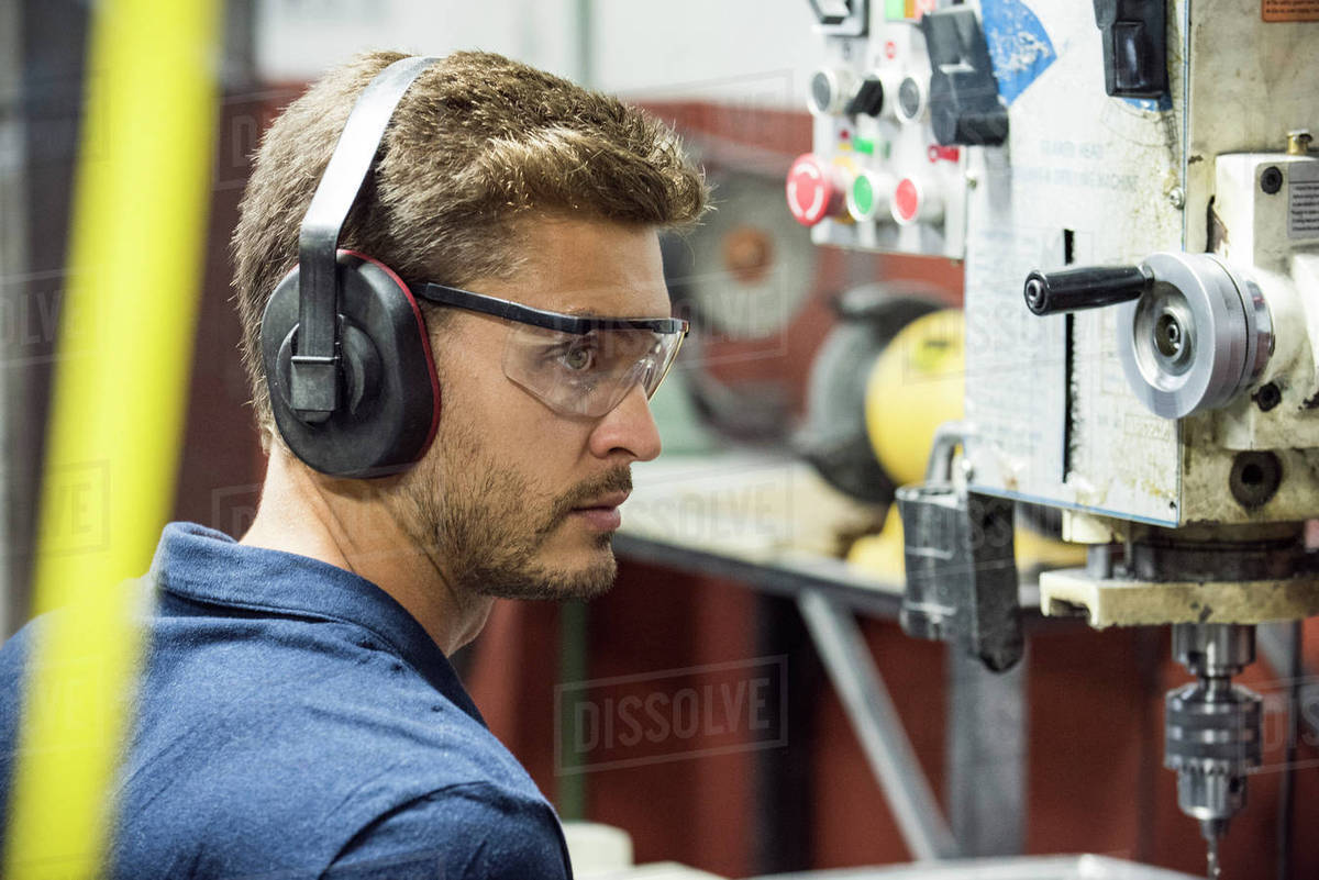 Machinist working in factory Royalty-free stock photo