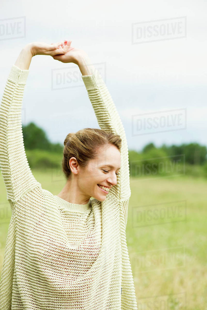 Woman stretching, portrait Stock Photo Dissolve