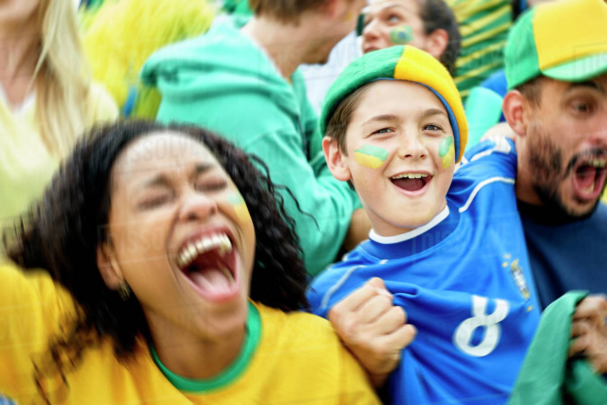 Brazilian football fans watching football match Royalty-free stock photo