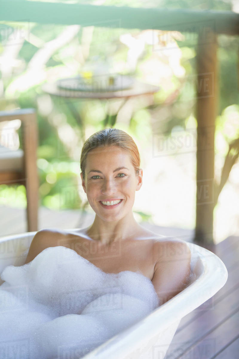 Woman relaxing in bubble bath Stock Photo Dissolve