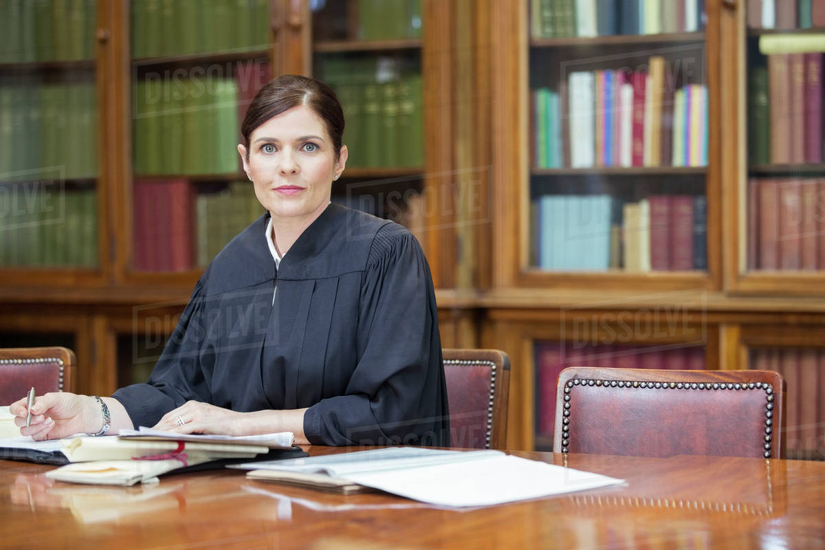 Judge doing research in chambers Stock Photo Dissolve