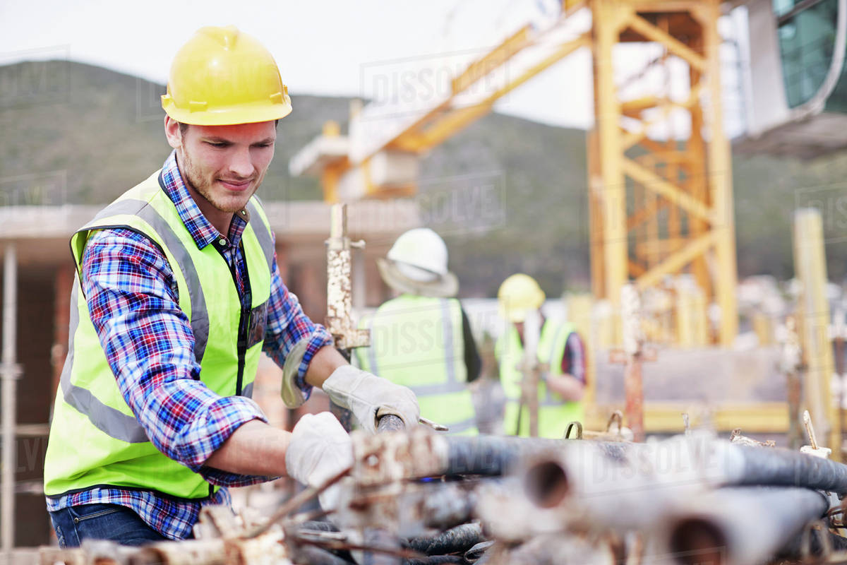 Construction worker working at construction site Stock Photo Dissolve