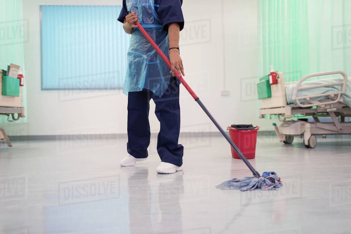 Female orderly mopping hospital ward floor Stock Photo Dissolve