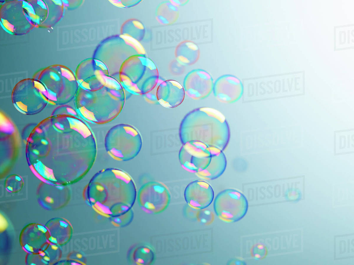 Translucent bubbles on blue background Stock Photo Dissolve