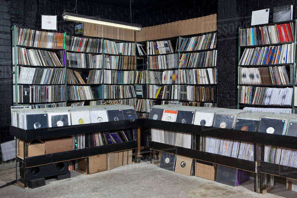 Rows of records on shelves and in bins at a record store - Royalty-free ...