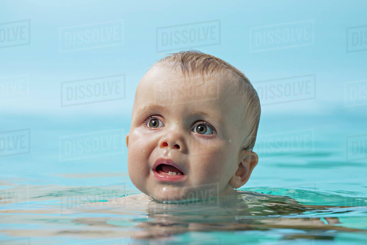 Baby in water Stock Photo Dissolve