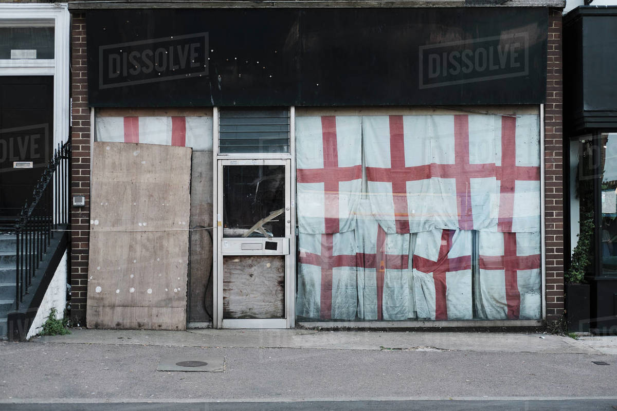 English flags covering abandoned storefront, Margate, England Royalty-free stock photo